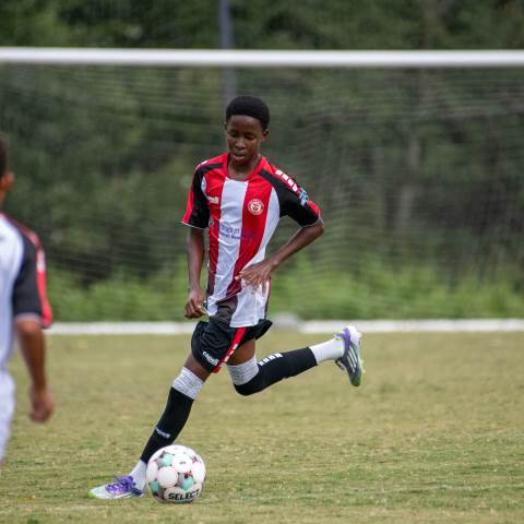 Mason playing soccer